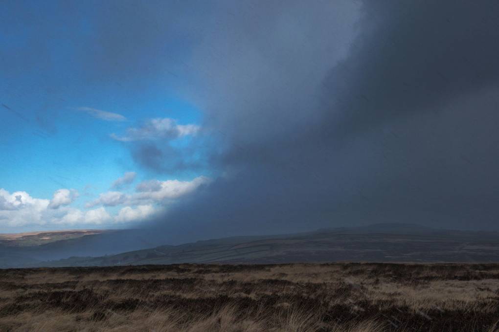 Hebden Bridge, West Yorkshire, A wintry shower on the Pennines above Hebden Bridge ...