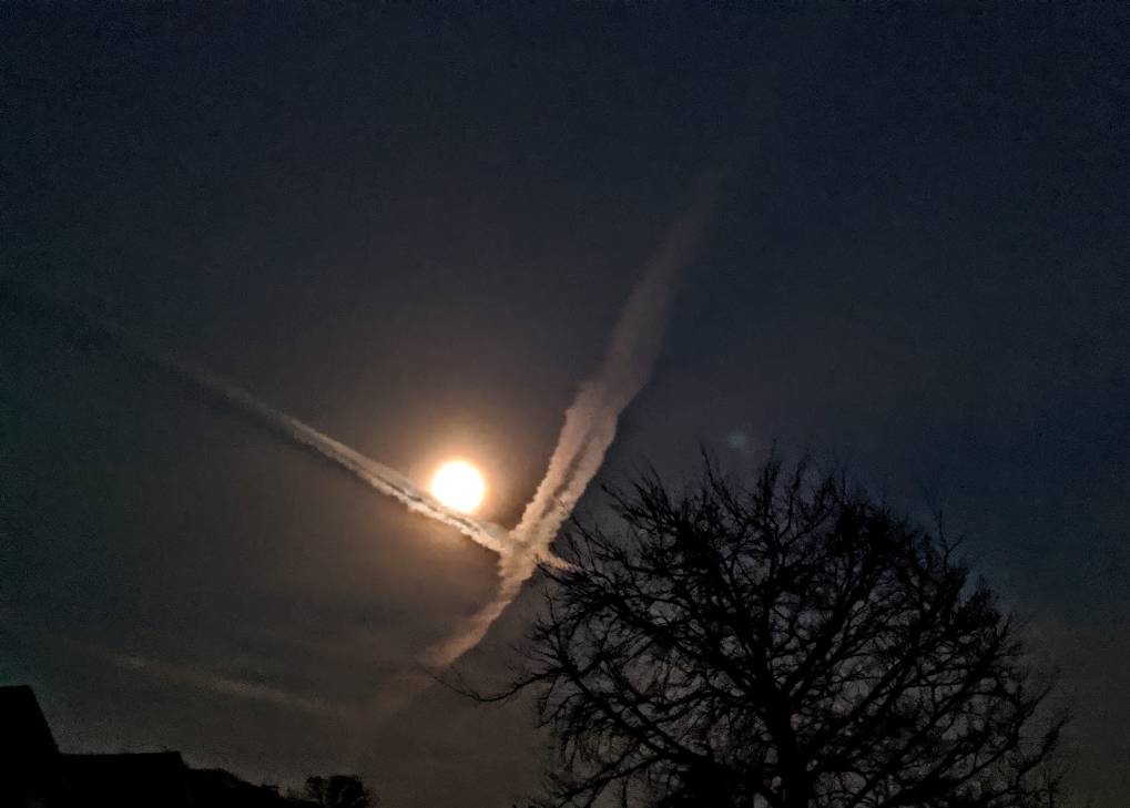 Berkhamsted, Hertfordshire, Moon and crossing contrails....