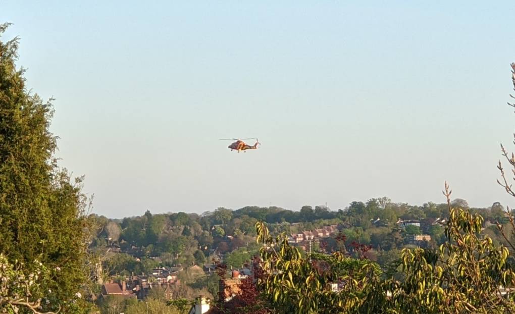Beautiful weather. Helicopter landing in the town centre. Berkhamsted, Hertfordshire,United Kingdom, sent by brian gaze