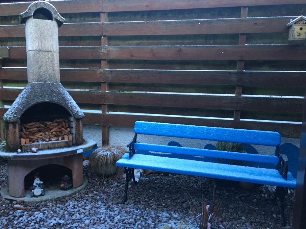 Grantown on Spey, Moray, Skiff of snow on the garden seat ...