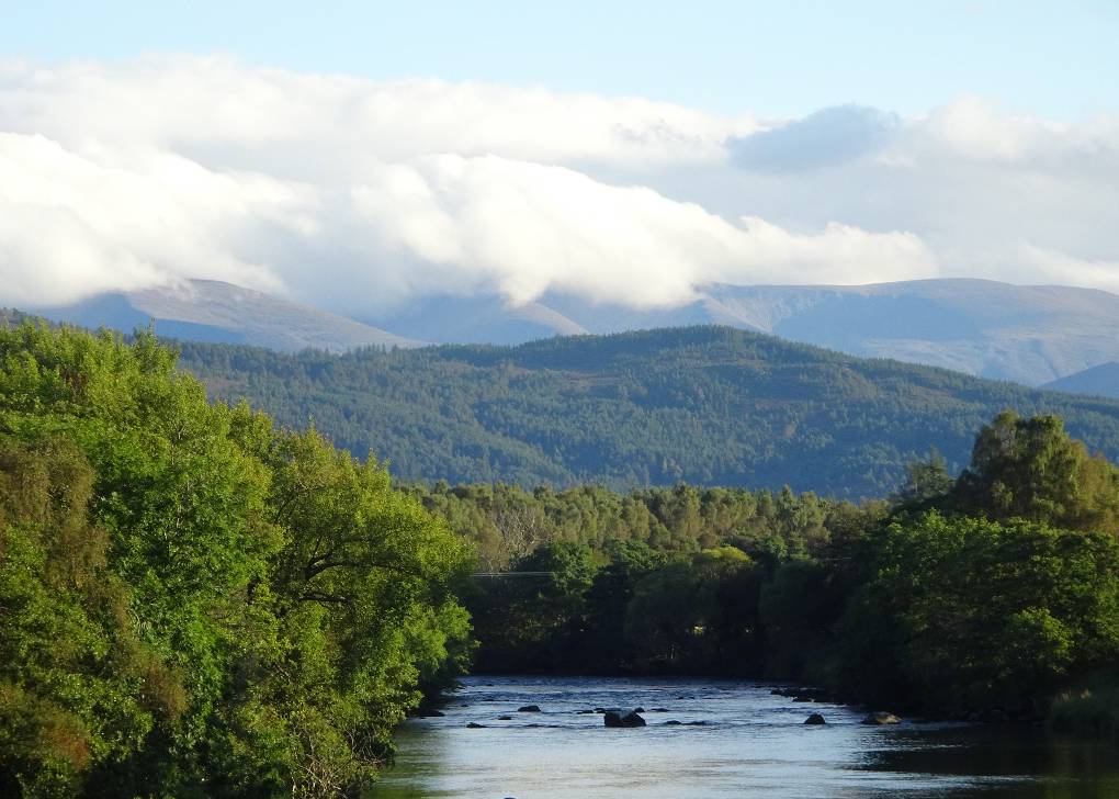 Boat of Garten, Strathspey, R Spey and cloud-covered Cairngorms from bridge at Boat of G....