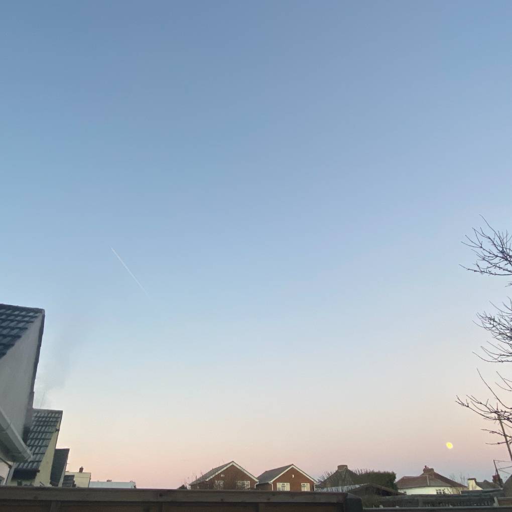 DARTFORD, Kent, Frosty roof's, moon setting and a contrail...