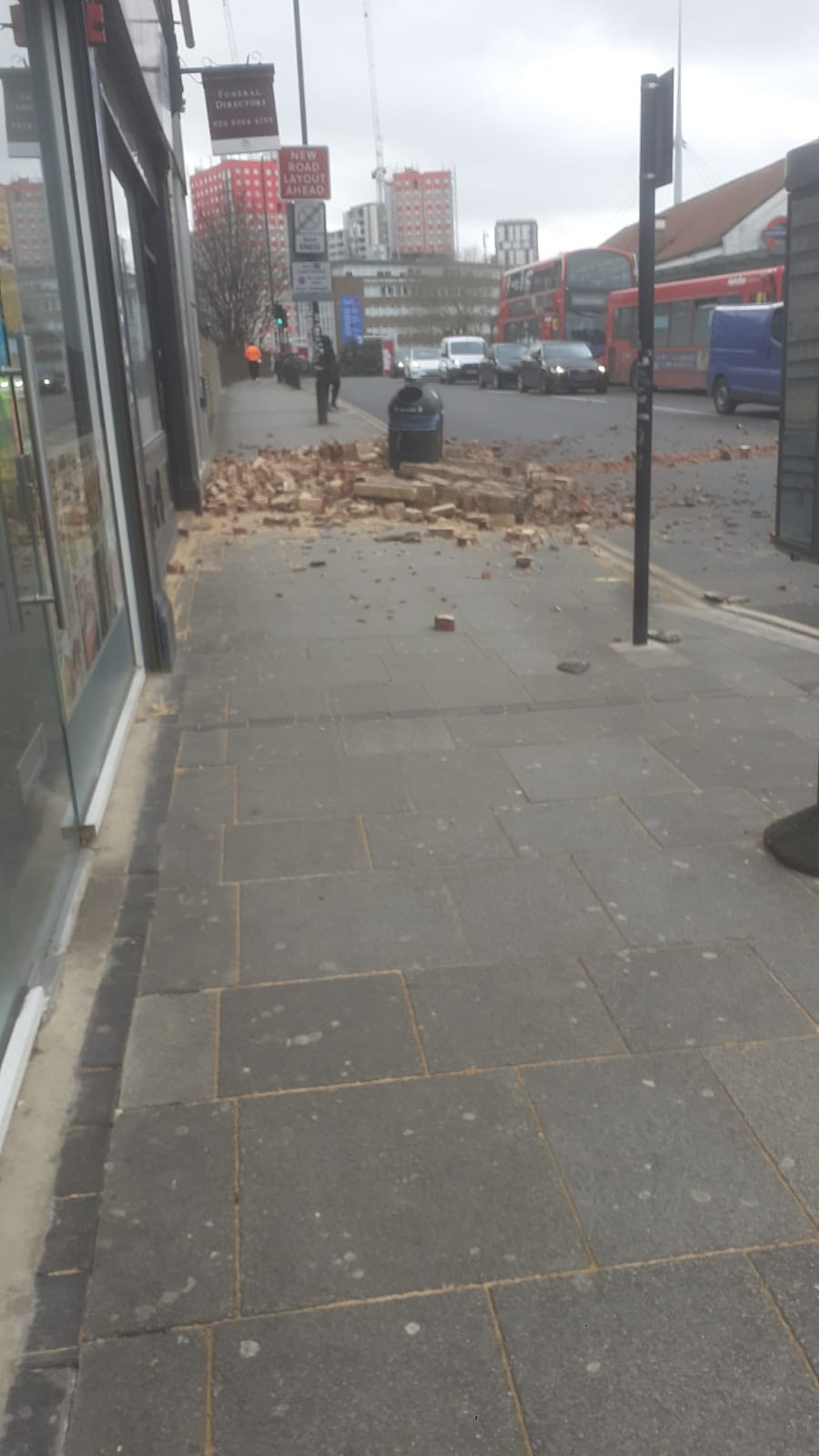 London, Wembley, Wind blows down wall Storm Eunice...