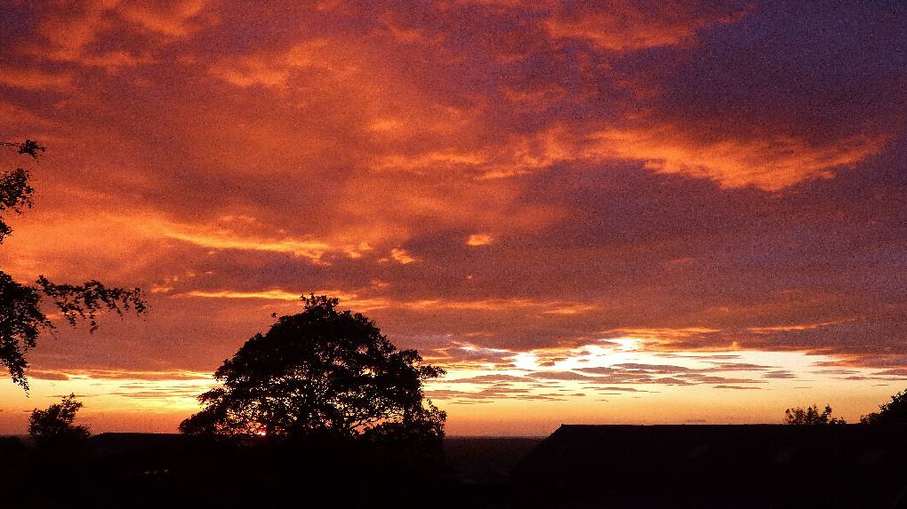 Blackrod, Lancashire, Stunning orange sunset from Blackrod on the evening of 4 June 2022. It has ...