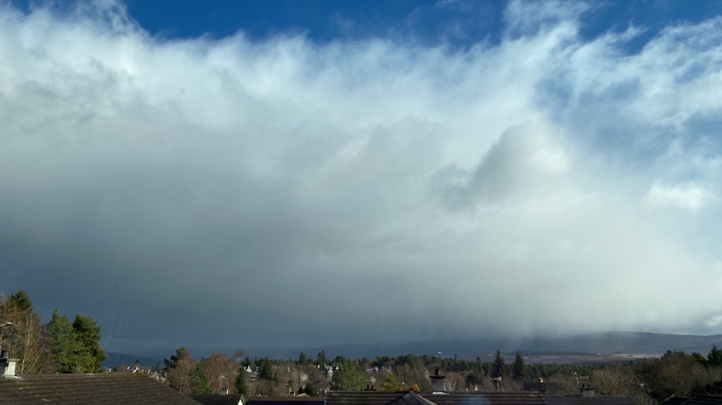 Big cloud approaching Grantown on Spey, Highlands,Scotland, sent by Dizzy Daff