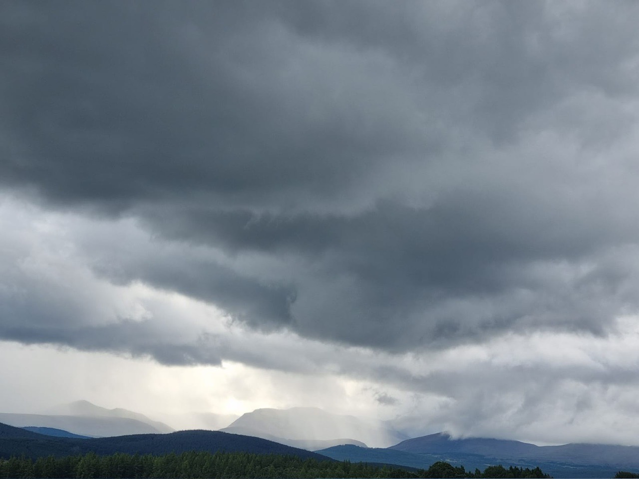 Grantown on Spey, Highlands, Heavy showers on the Cairngorm mountains....