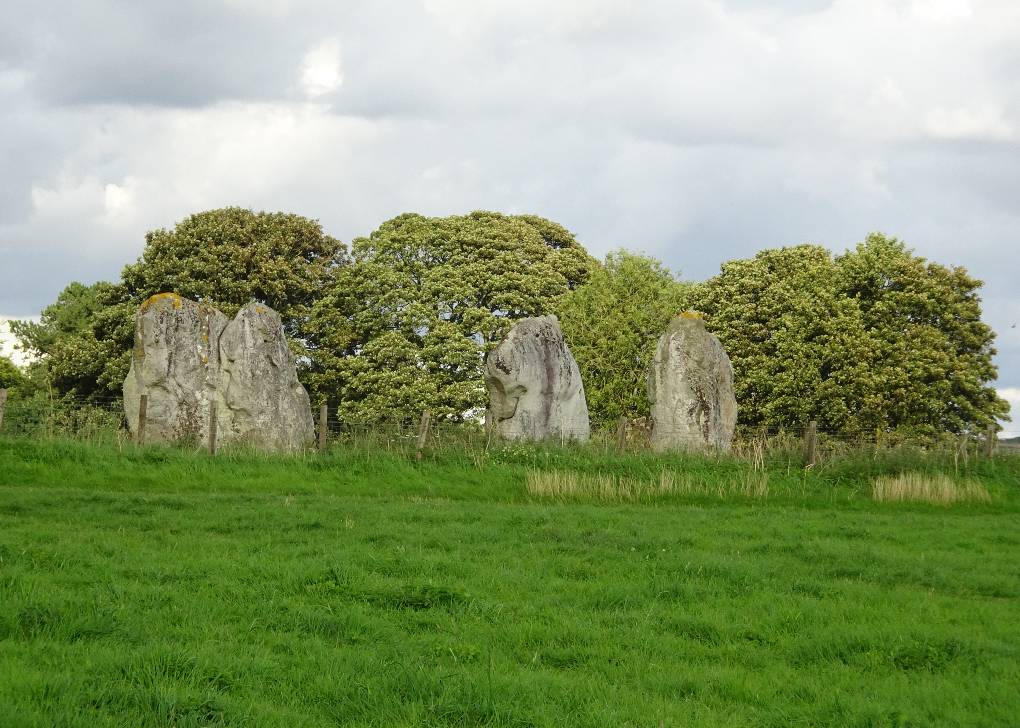 Avebury, Wilts, Three of the larger stones, late summer afternoon, breeze turning leaves of...
