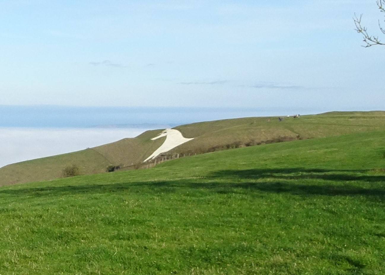 Westbury, Wilts, Westbury White Horse looking out over cloud-covered clay vale to N, edge of...