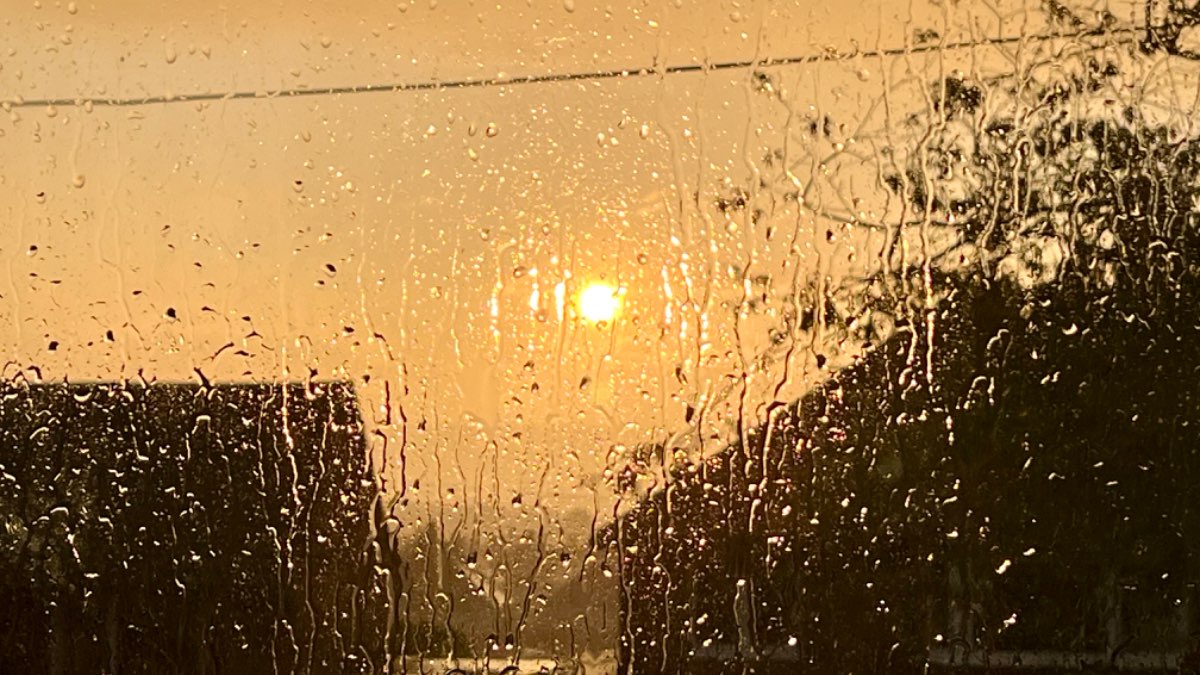 Leek, Staffordshire, Heavy evening shower with the setting sun chasing ....