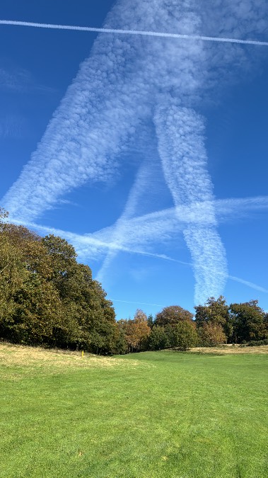 Midhurst, West Sussex, Multiple vapour trails above the 4th hole at Cowdray Park Golf Club...