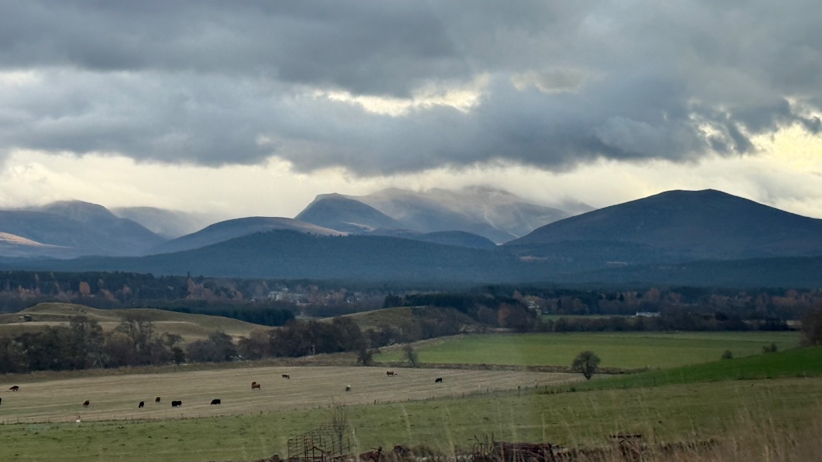 Grantown on Spey, Highlands, Looking over the River Spey to Nethybridge. Showers on the Cairngorms....